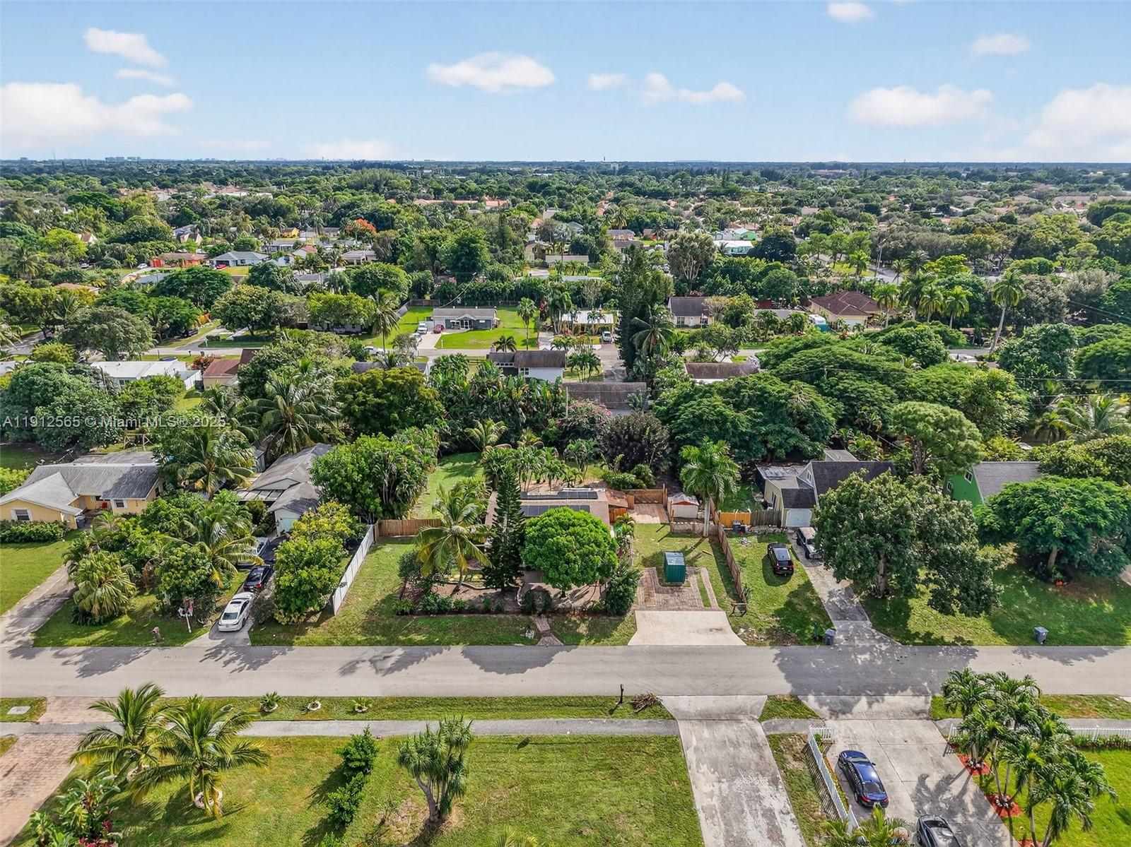 5172 Pine Tree Drive Delray Beach, FL 33484 - Photo 39 of 59 an aerial view of residential houses with outdoor space and trees