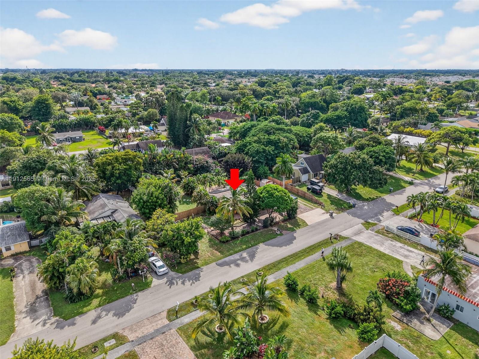 5172 Pine Tree Drive Delray Beach, FL 33484 - Photo 45 of 59 an aerial view of residential houses with outdoor space and trees