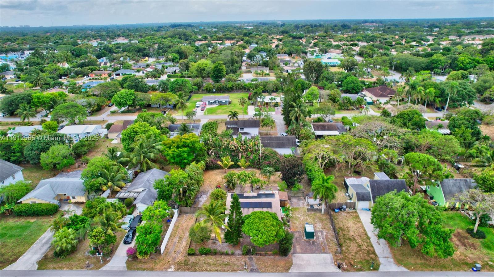 5172 Pine Tree Drive Delray Beach, FL 33484 - Photo 49 of 59 an aerial view of residential houses with outdoor space and trees