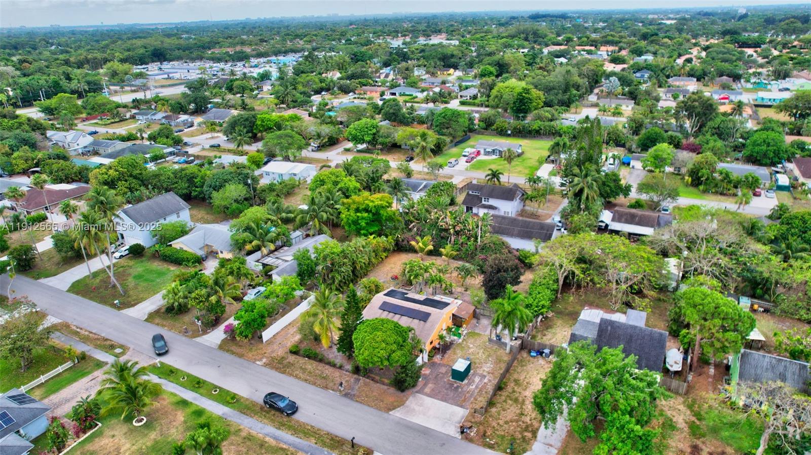 5172 Pine Tree Drive Delray Beach, FL 33484 - Photo 50 of 59 an aerial view of residential houses with outdoor space and trees