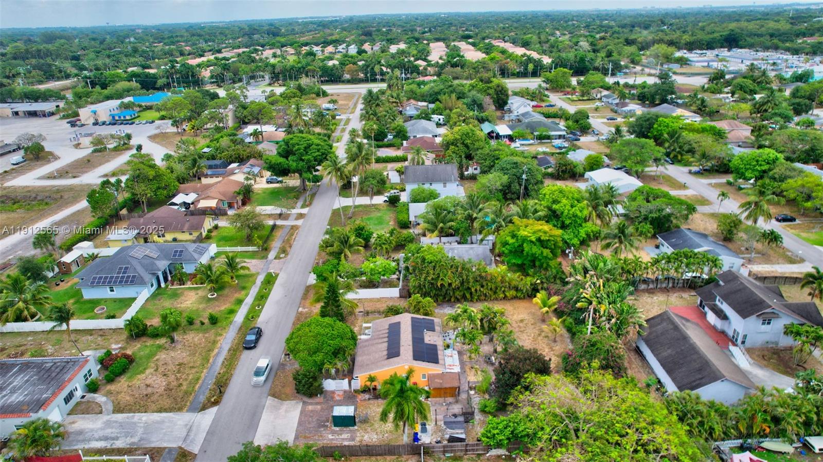 5172 Pine Tree Drive Delray Beach, FL 33484 - Photo 51 of 59 an aerial view of residential houses with outdoor space and trees