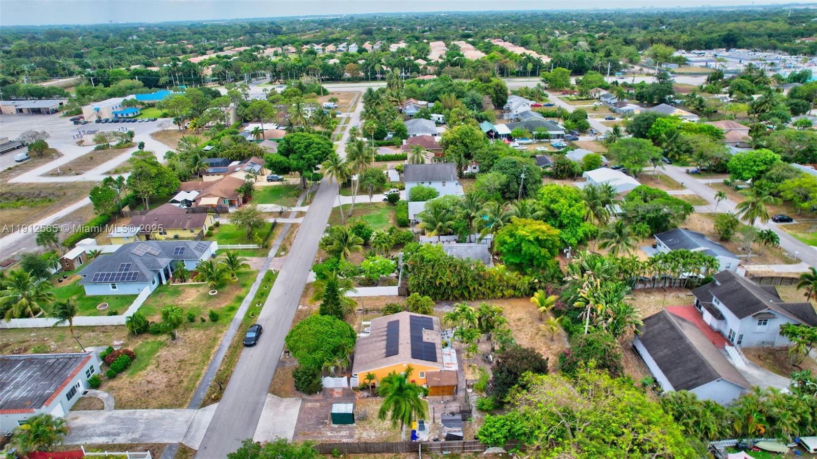5172 Pine Tree Drive Delray Beach, FL 33484 - Photo 52 of 59 an aerial view of residential houses with outdoor space and street view