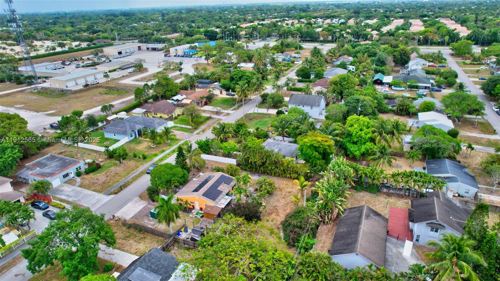 5172 Pine Tree Drive Delray Beach, FL 33484 - Photo 53 of 59 an aerial view of residential houses with outdoor space and trees