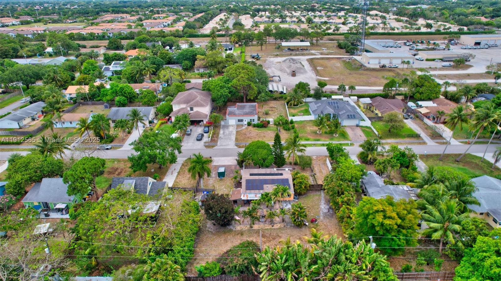 5172 Pine Tree Drive Delray Beach, FL 33484 - Photo 54 of 59 an aerial view of residential houses with outdoor space and trees all around