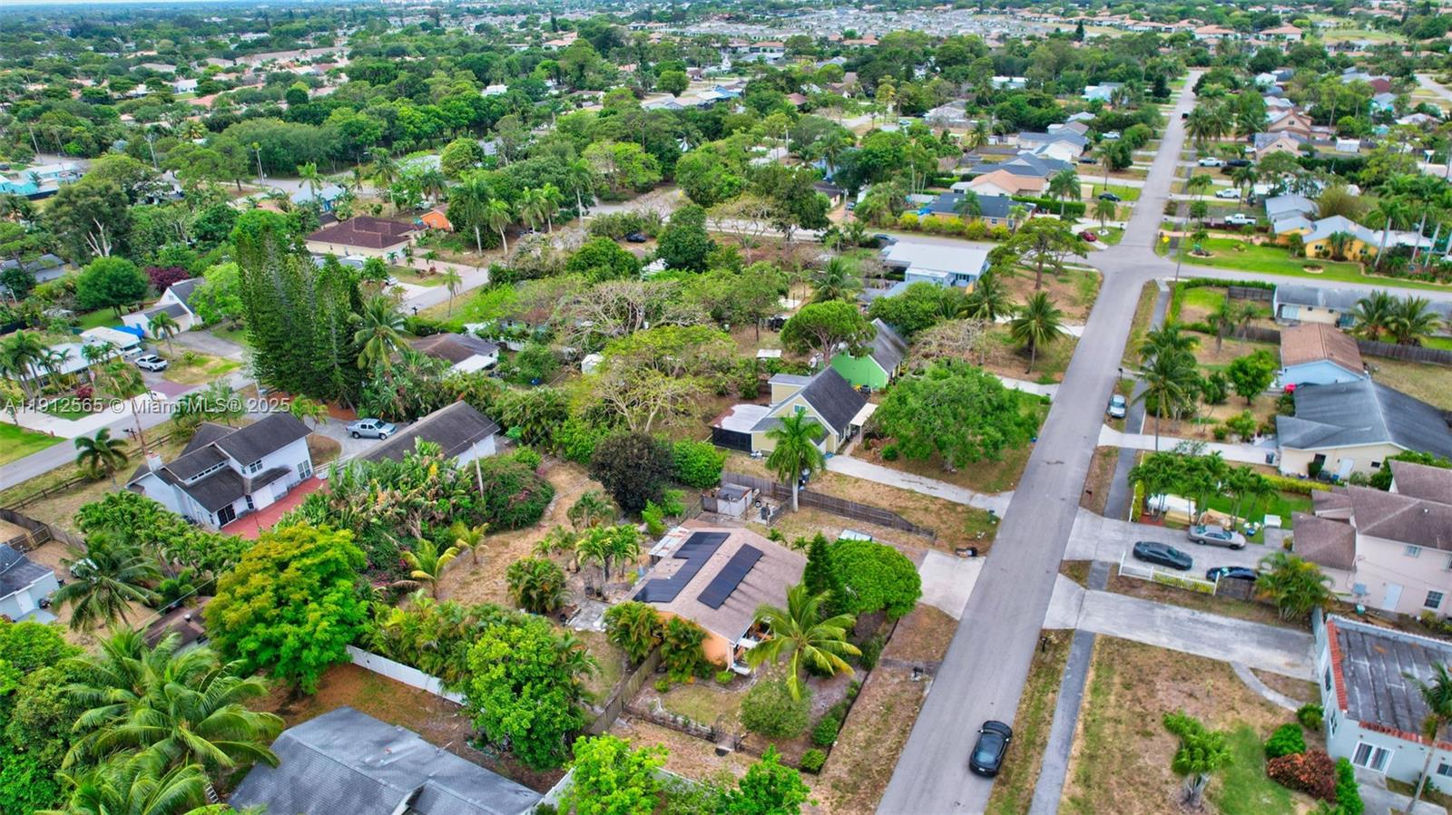 5172 Pine Tree Drive Delray Beach, FL 33484 - Photo 56 of 59 an aerial view of residential houses with outdoor space and trees