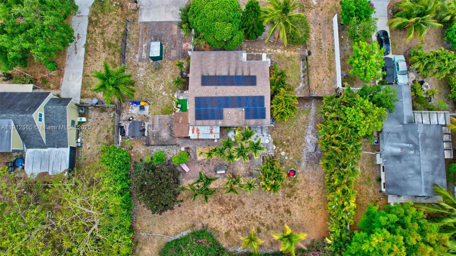 5172 Pine Tree Drive Delray Beach, FL 33484 - Photo 57 of 59 an aerial view of a house with swimming pool and garden