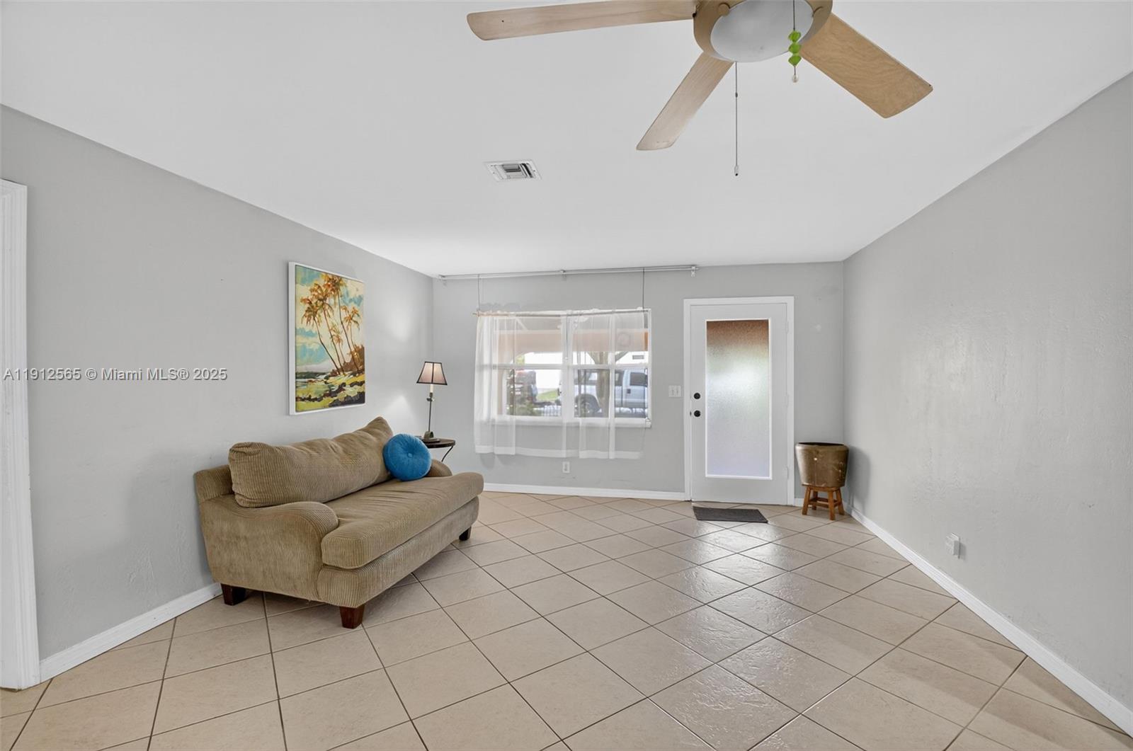 5172 Pine Tree Drive Delray Beach, FL 33484 - Photo 6 of 59 a living room with furniture and a window