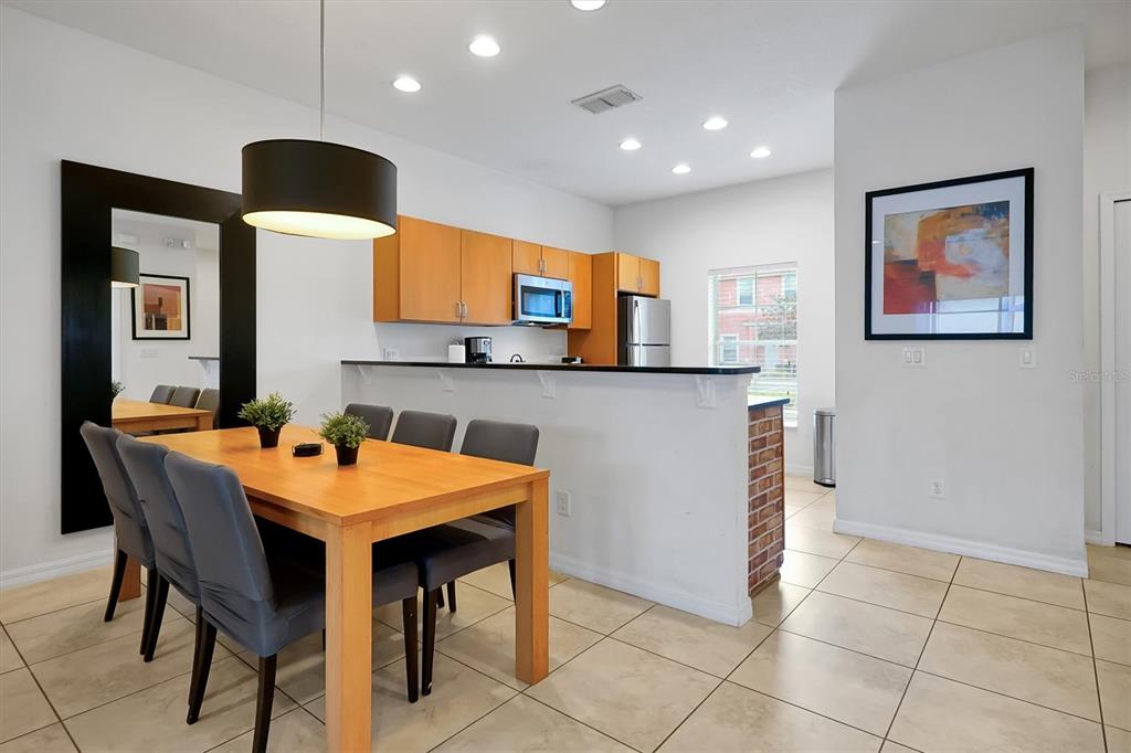 3011 Red Ginger Road Kissimmee, FL 34747 - Photo 13 of 62 a view of a kitchen with a table and chairs