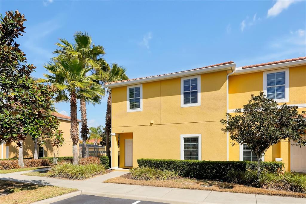 3011 Red Ginger Road Kissimmee, FL 34747 - Photo 2 of 62 a front view of a house with a tree