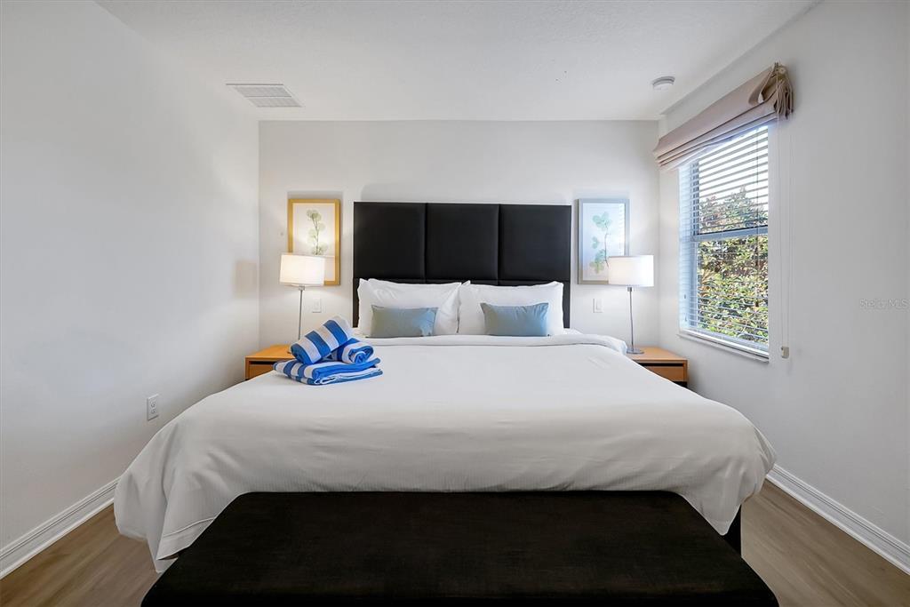 3011 Red Ginger Road Kissimmee, FL 34747 - Photo 23 of 62 a bedroom with a bed and a window