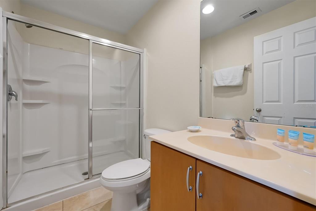 3011 Red Ginger Road Kissimmee, FL 34747 - Photo 30 of 62 a bathroom with a sink toilet and shower