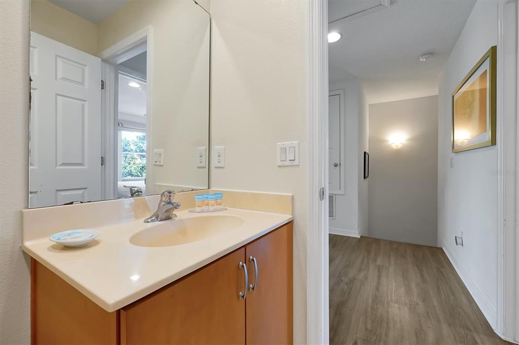 3011 Red Ginger Road Kissimmee, FL 34747 - Photo 31 of 62 a bathroom with a sink a mirror and a toilet