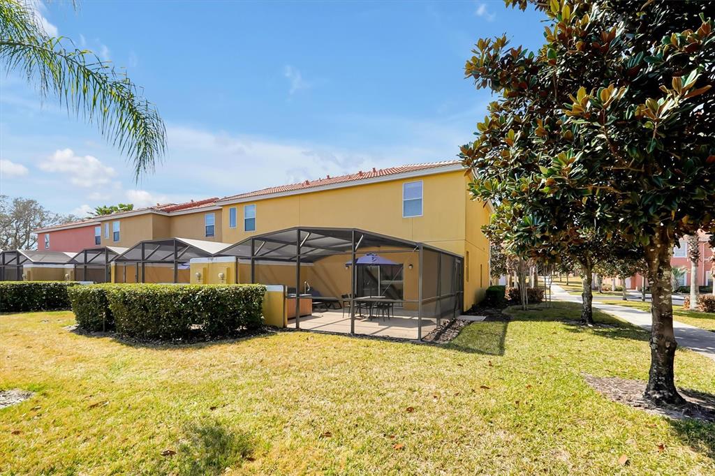 3011 Red Ginger Road Kissimmee, FL 34747 - Photo 35 of 62 a swimming pool with outdoor seating and yard