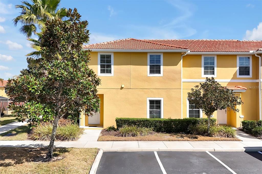3011 Red Ginger Road Kissimmee, FL 34747 - Photo 36 of 62 front view of a house with a yard