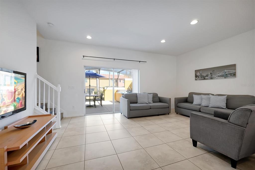 3011 Red Ginger Road Kissimmee, FL 34747 - Photo 4 of 62 a living room with furniture and a flat screen tv