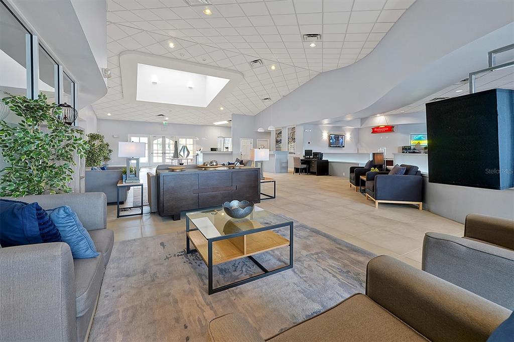 3011 Red Ginger Road Kissimmee, FL 34747 - Photo 56 of 62 a living room with furniture and a flat screen tv