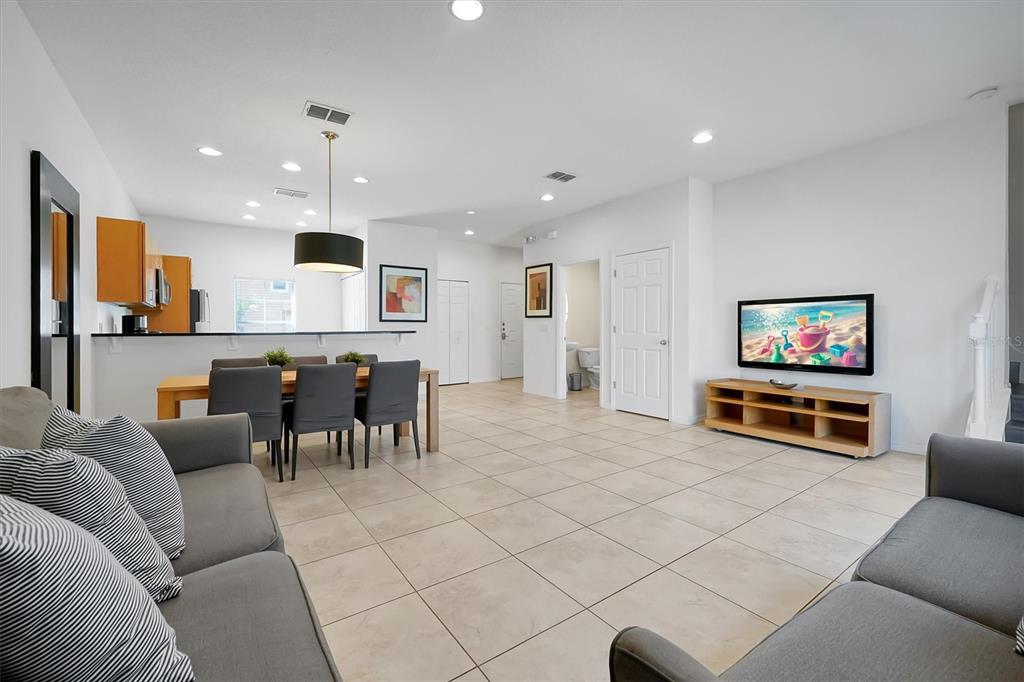 3011 Red Ginger Road Kissimmee, FL 34747 - Photo 6 of 62 a living room with furniture and a flat screen tv