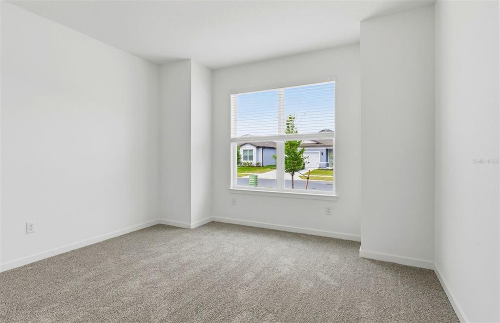 3734 Obsidian Drive Spring Hill, FL 34609 - Photo 12 of 25 an empty room with windows