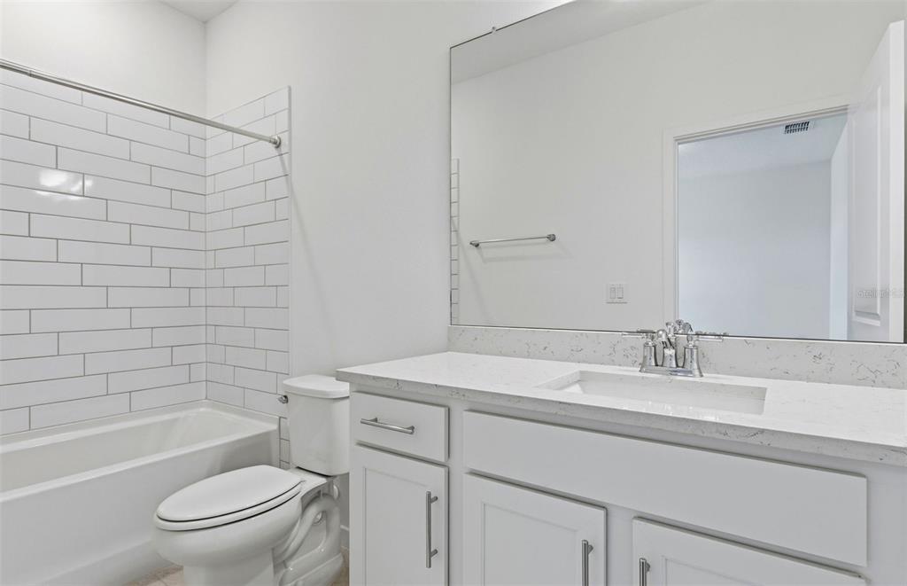 3734 Obsidian Drive Spring Hill, FL 34609 - Photo 16 of 25 a bathroom with a sink a toilet and shower