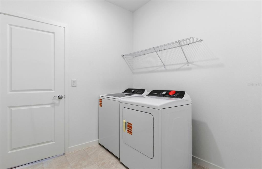 3734 Obsidian Drive Spring Hill, FL 34609 - Photo 17 of 25 a utility room with dryer and washer