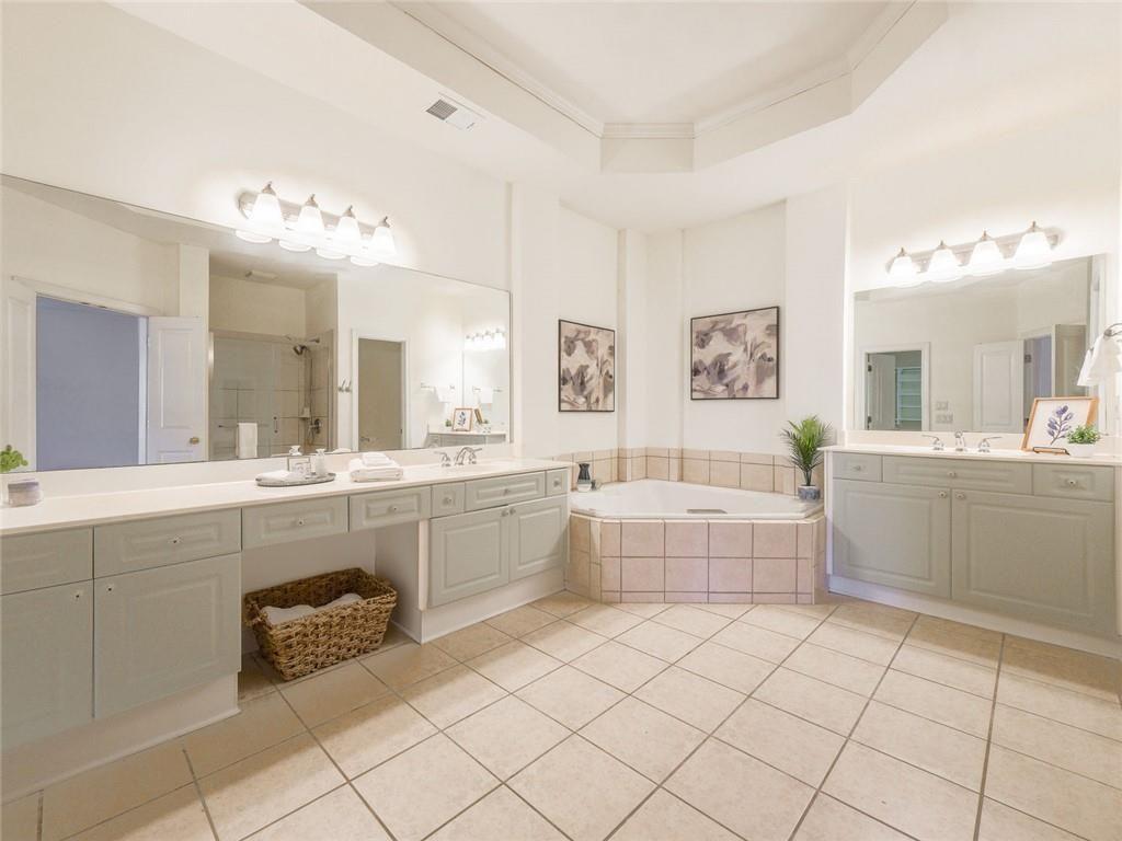 1051 Emory Parc Place Decatur, GA 30033 - Photo 13 of 30 a large white bathroom with a large tub sink vanity and granite