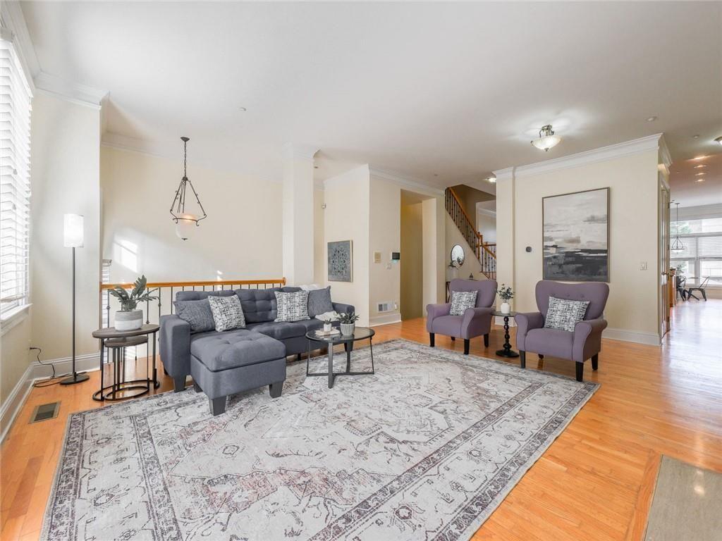 1051 Emory Parc Place Decatur, GA 30033 - Photo 3 of 30 a living room with furniture and wooden floor