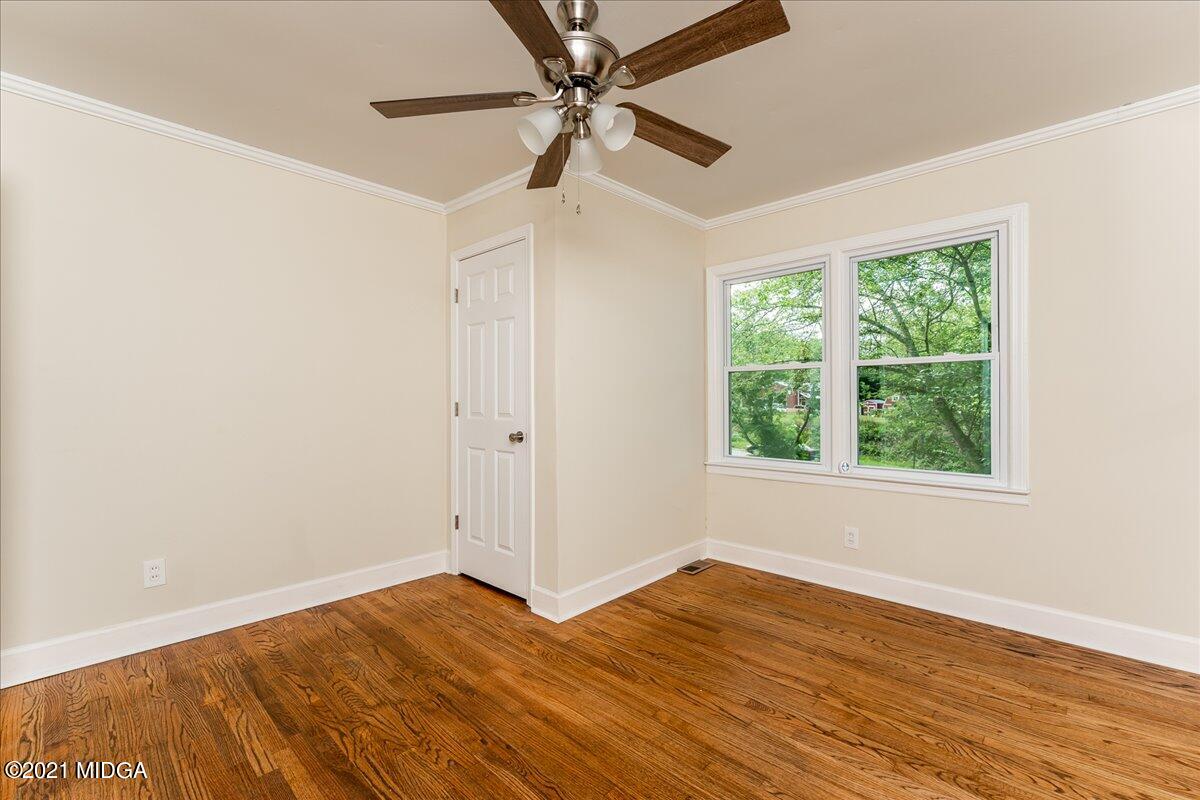 5611 Sardis Church Road Macon, GA 31216 - Photo 15 of 32 a view of an empty room with wooden floor and a window