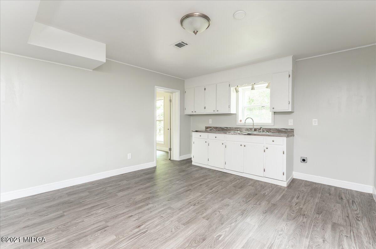 5611 Sardis Church Road Macon, GA 31216 - Photo 23 of 32 a view of a kitchen with wooden floor