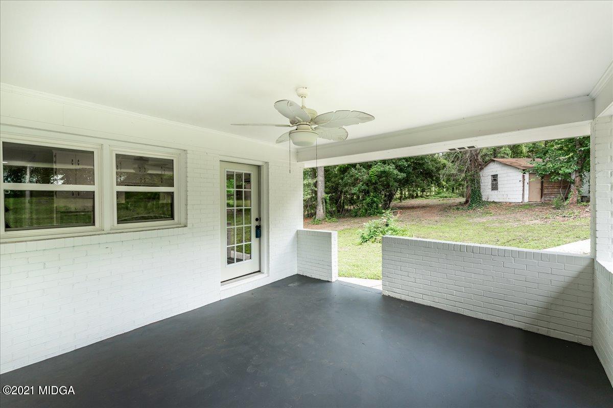 5611 Sardis Church Road Macon, GA 31216 - Photo 4 of 32 a view of a living room and kitchen with a large window