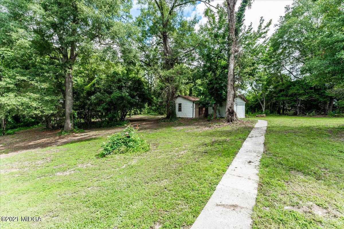 5611 Sardis Church Road Macon, GA 31216 - Photo 5 of 32 a view of a backyard with large trees
