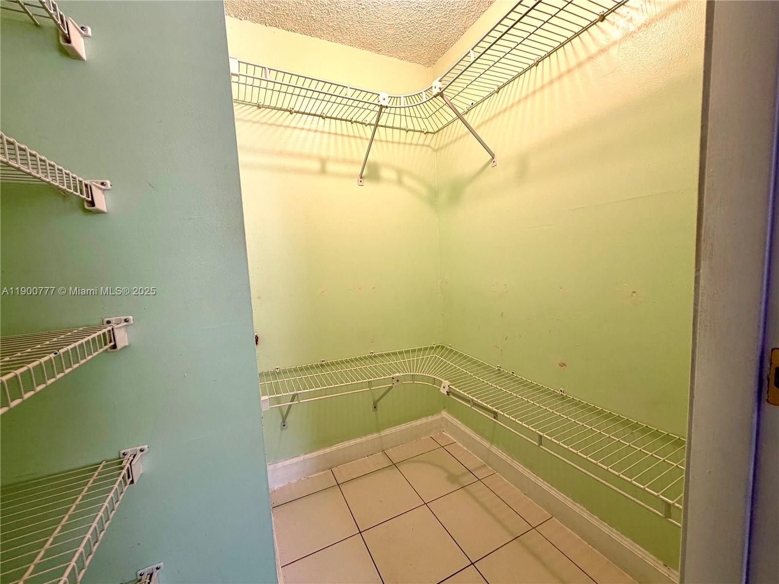 5201 Northwest 7th Street, Unit 212 Miami, FL 33126 - Photo 30 of 34 a view of a room with racks on the wall