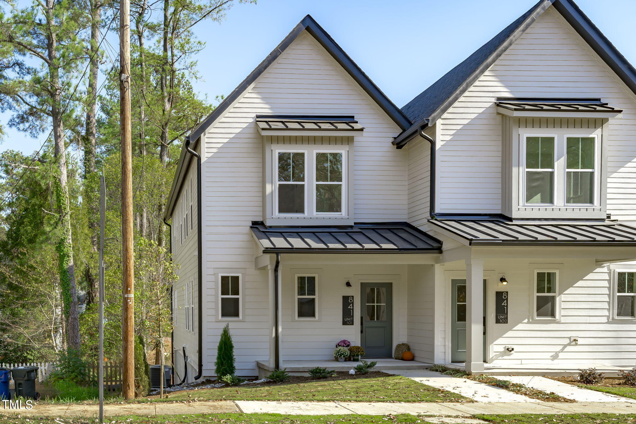 901 Athens Drive, Unit 101 Raleigh, NC 27606 - Photo 1 of 62 a view of a brick house with large windows