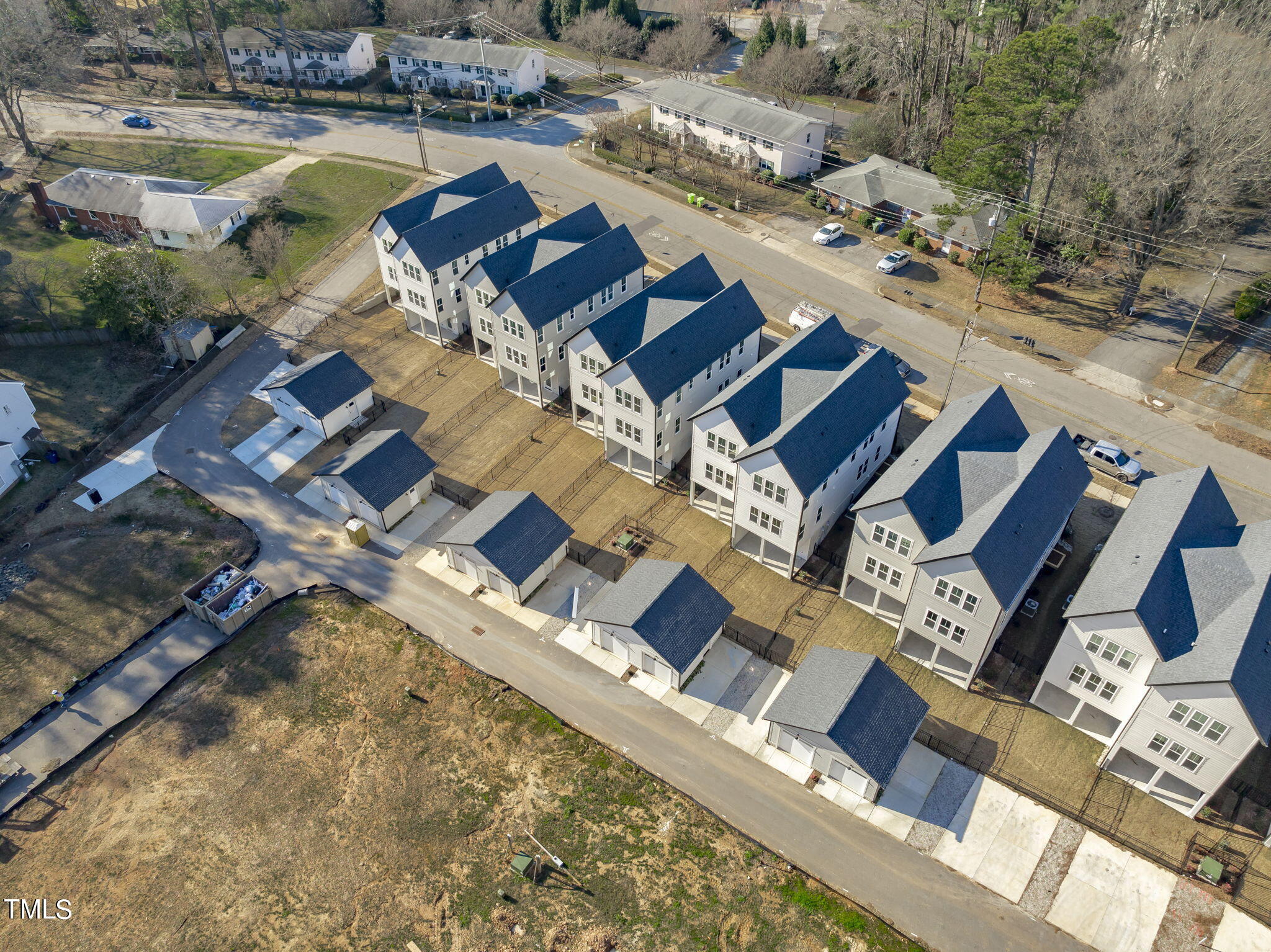 901 Athens Drive, Unit 101 Raleigh, NC 27606 - Photo 52 of 62 an aerial view of a house with garden space and swimming pool