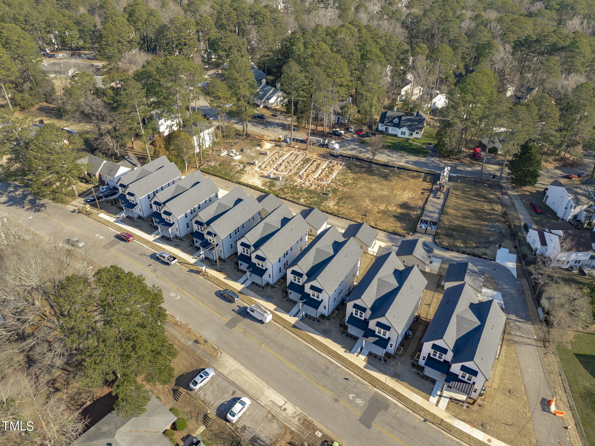 901 Athens Drive, Unit 101 Raleigh, NC 27606 - Photo 55 of 62 an aerial view of a house with a swimming pool