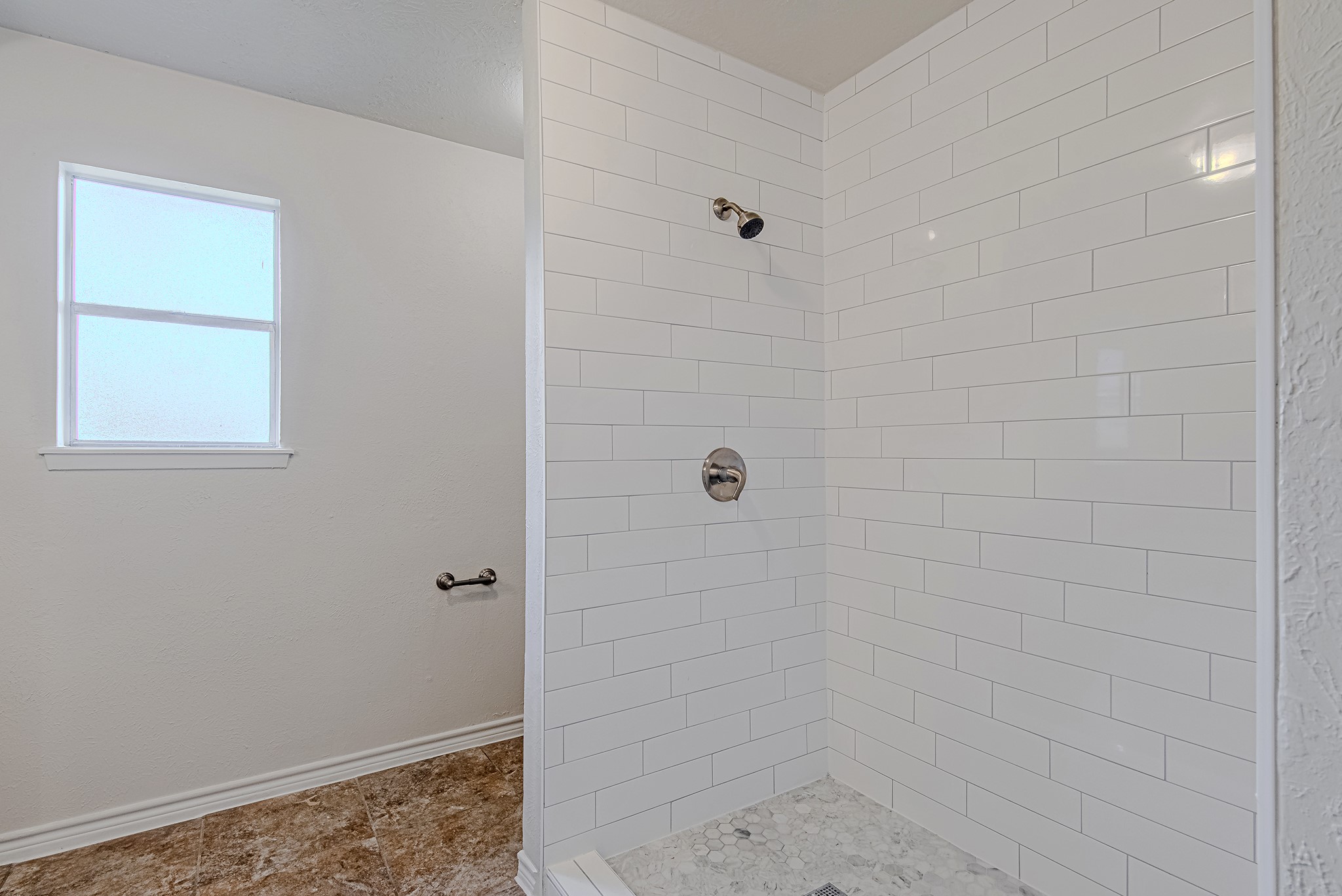 24306 Spring Mill Lane Spring, TX 77373 - Photo 17 of 24 a bathroom with a shower