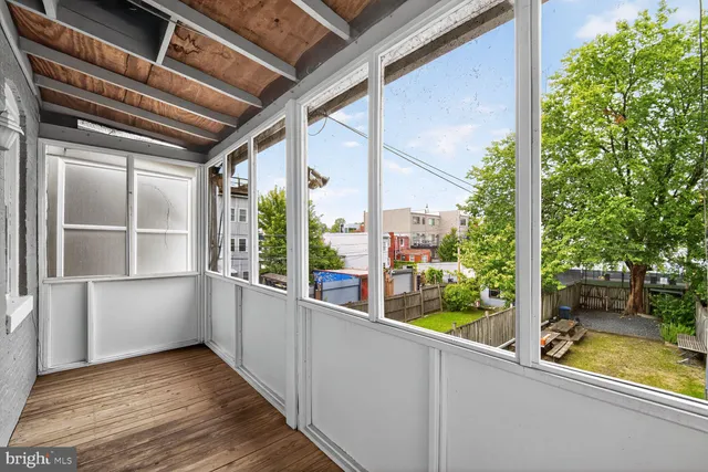 a view of a balcony with wooden floor