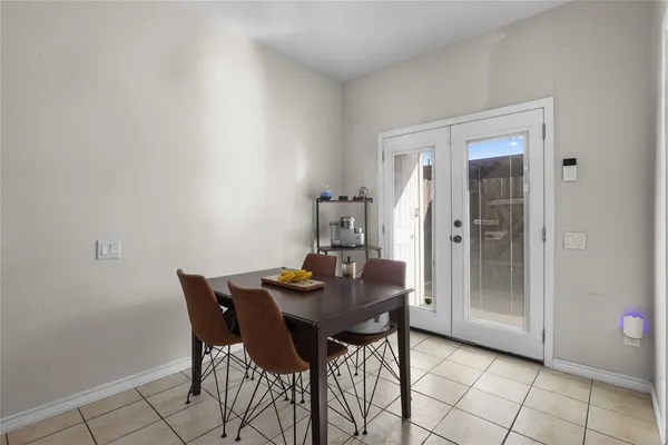 a kitchen with a refrigerator and a sink
