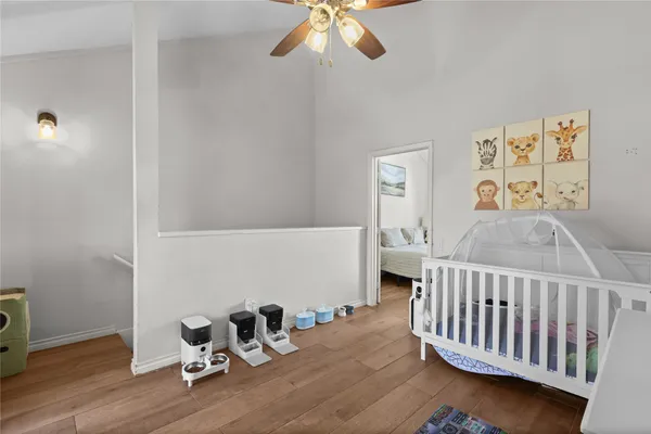 a bedroom with a bed a table and chair