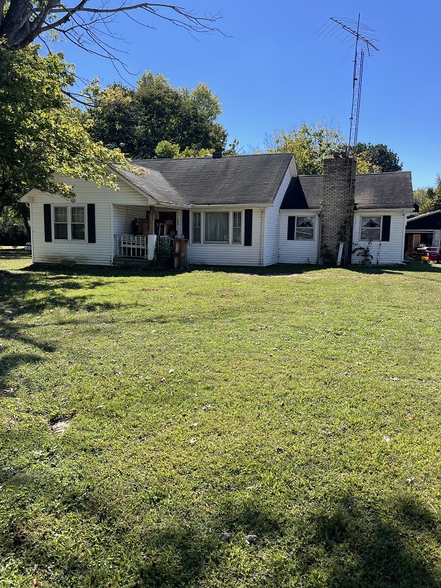 902 Days Road Lafayette, TN 37083 - Photo 23 of 65 a front view of a house with a garden