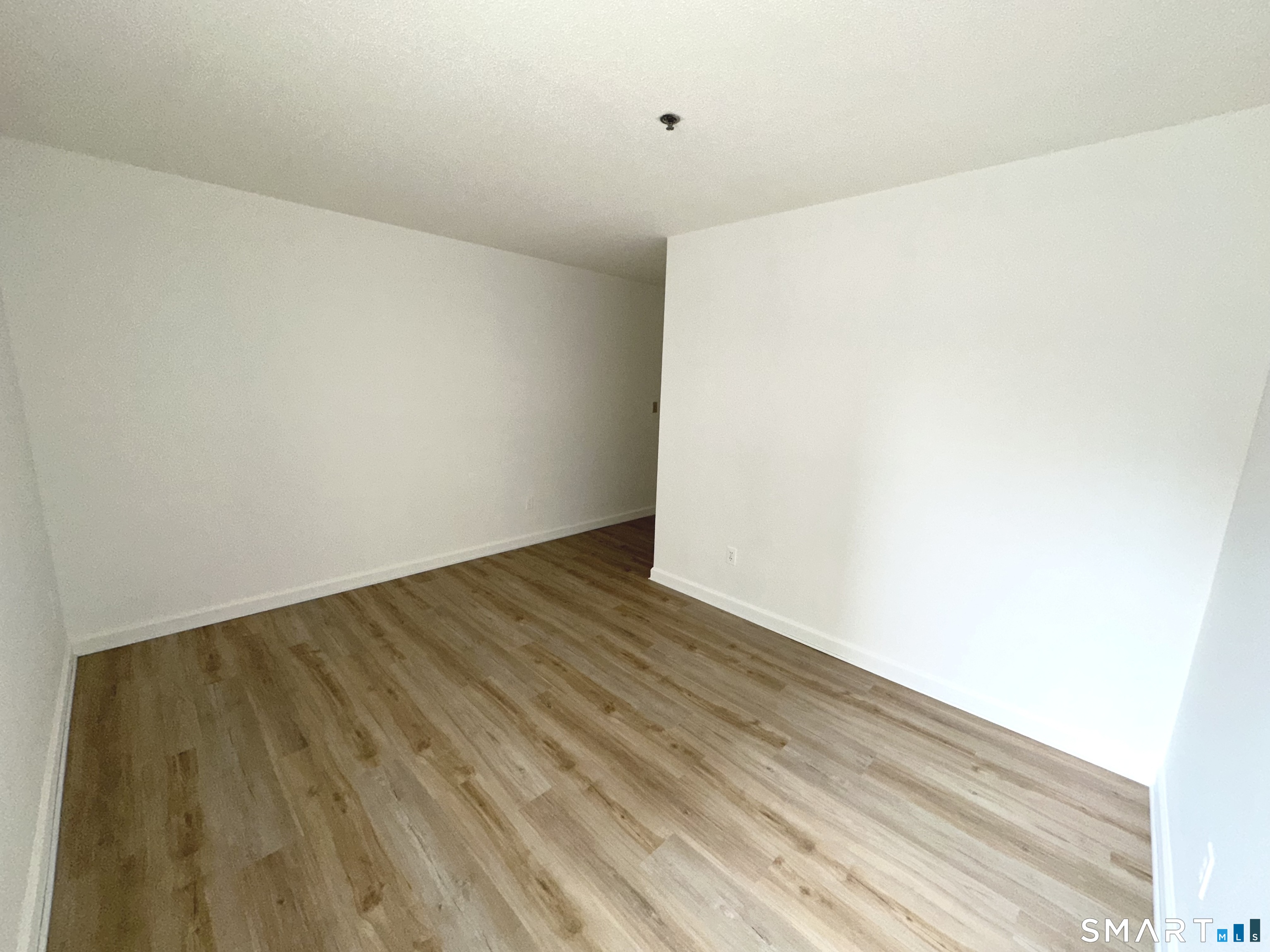 243 Judd Square, Unit 243 Wallingford, CT 06492 - Photo 12 of 17 a view of an empty room