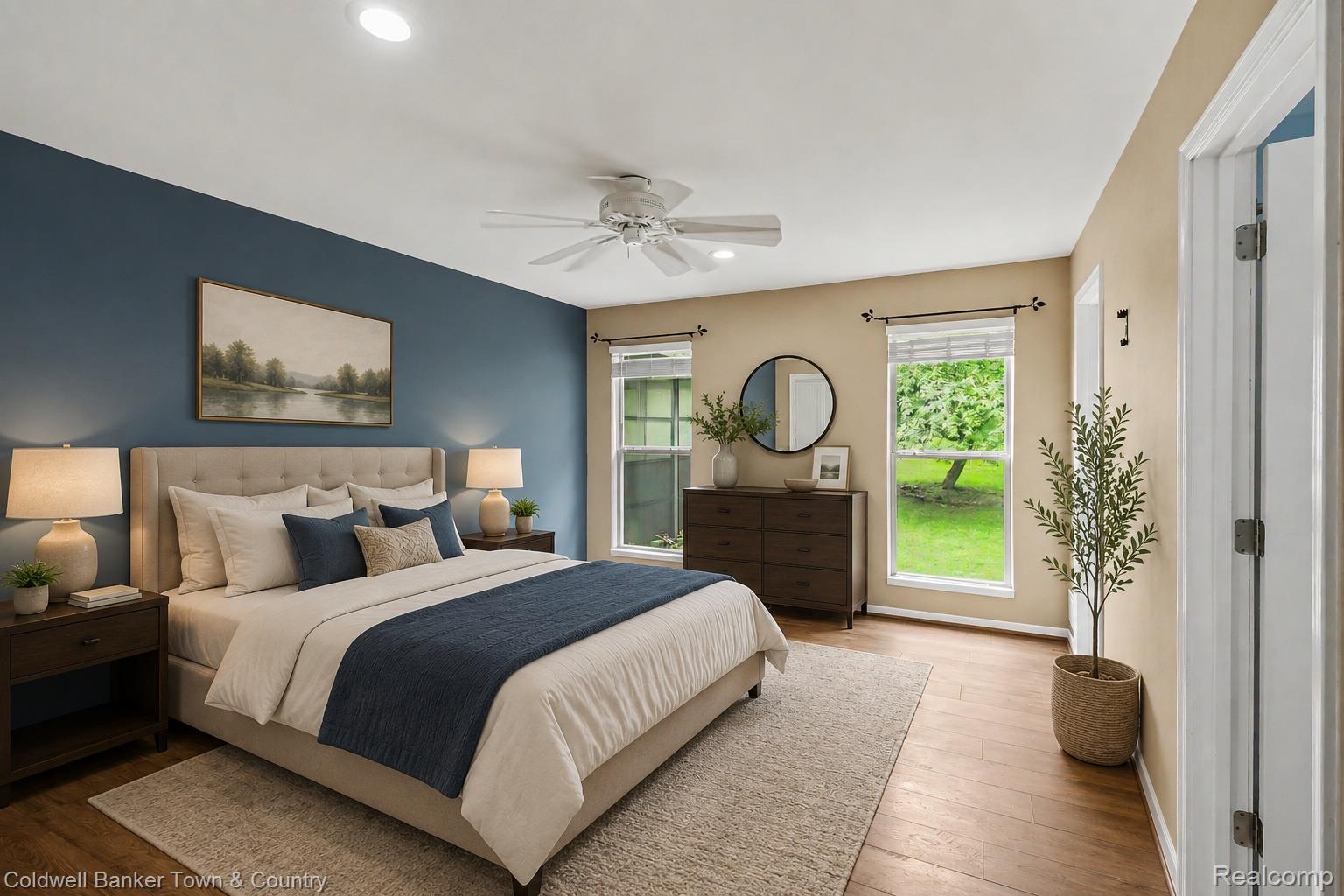 332 Triangle Lake Road Howell, MI 48843 - Photo 10 of 27 Bedroom featuring a striking accent wall, wood-finish flooring, recessed ceiling lighting, and a ceiling fan
