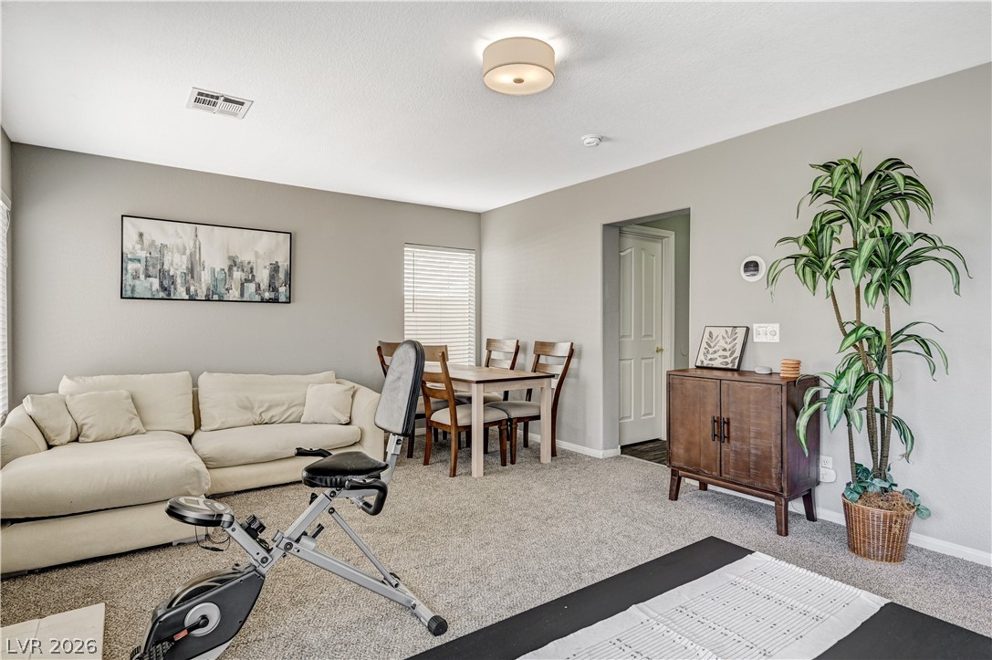 8863 Chapman Point Las Vegas, NV 89129 - Photo 17 of 22 Living area featuring carpet and baseboards