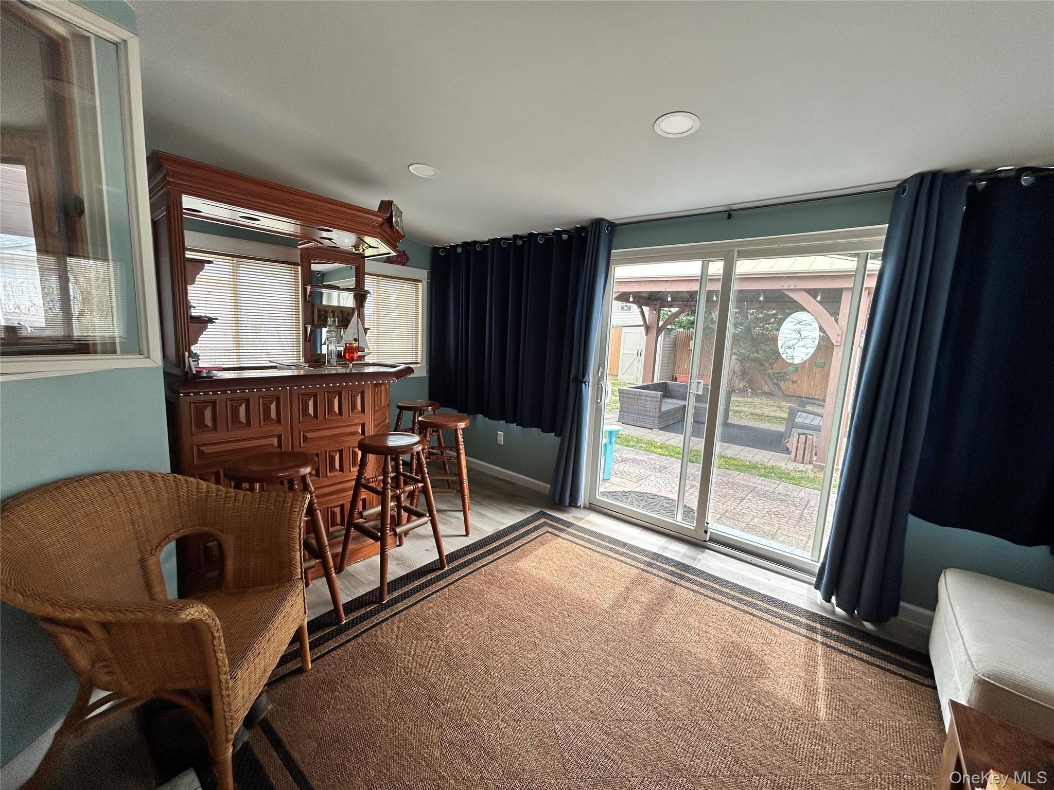 136 B Hampton Avenue Mastic, NY 11950 - Photo 12 of 21 a view of a livingroom with furniture and wooden floor