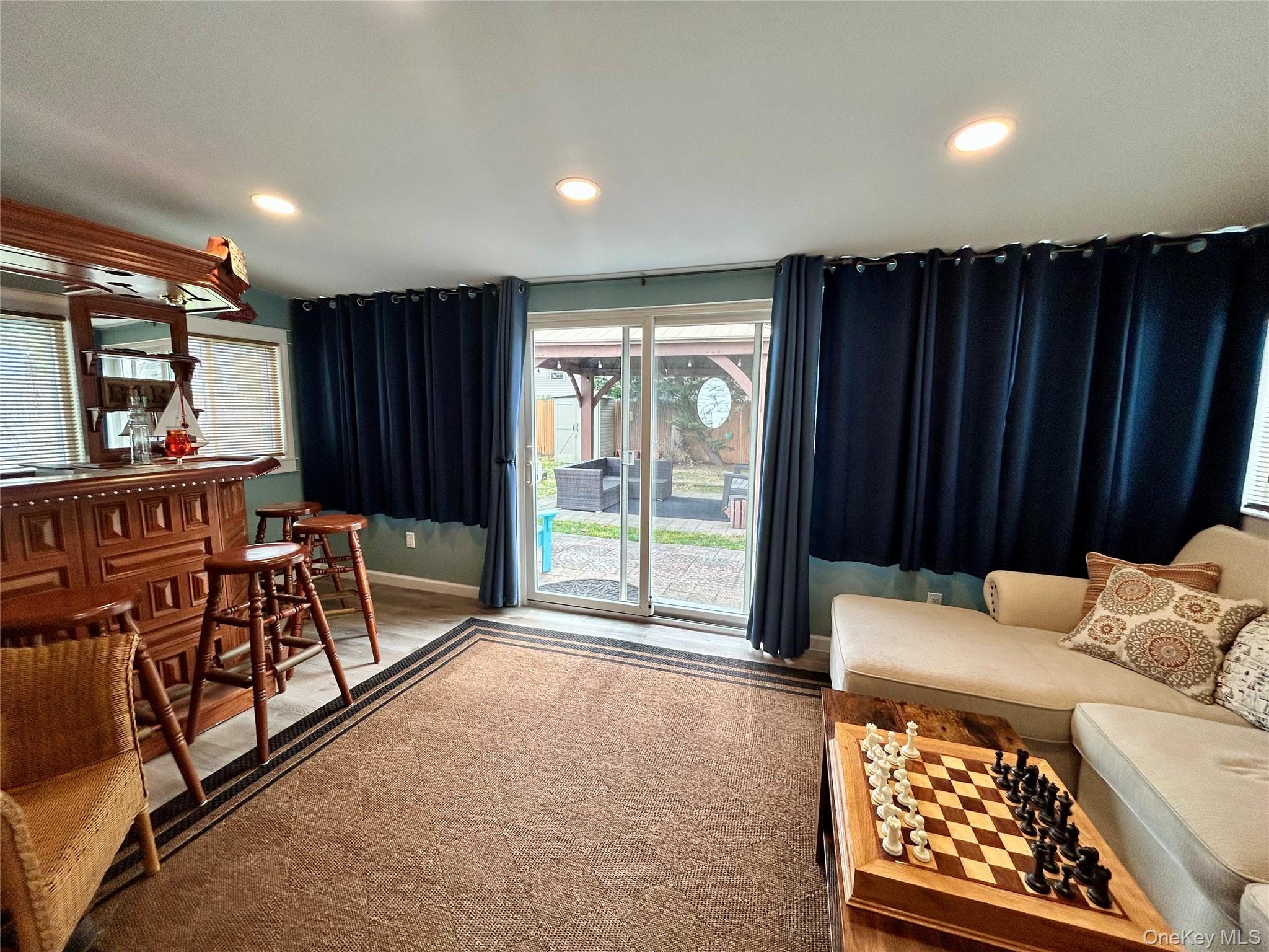 136 B Hampton Avenue Mastic, NY 11950 - Photo 14 of 21 a bed room with furniture and a window