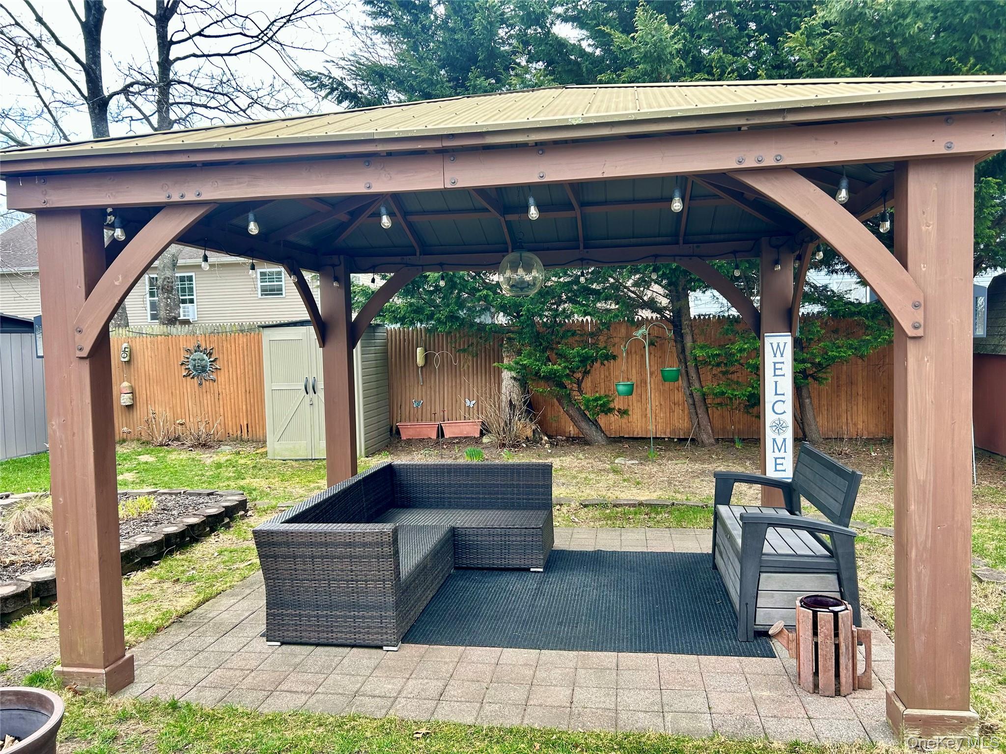 136 B Hampton Avenue Mastic, NY 11950 - Photo 15 of 21 a front view of a house with garden