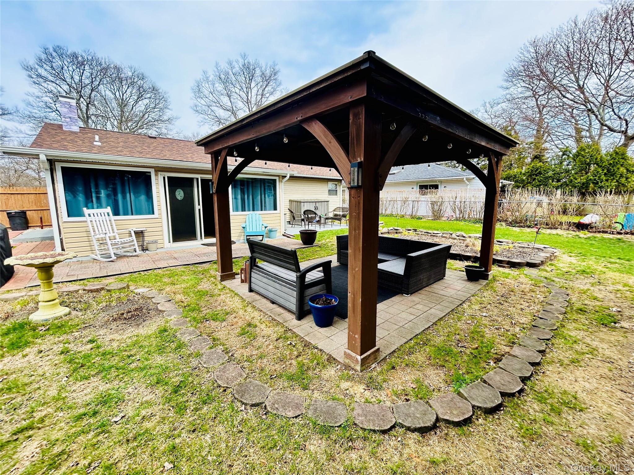 136 B Hampton Avenue Mastic, NY 11950 - Photo 19 of 21 a view of house with outdoor seating yard
