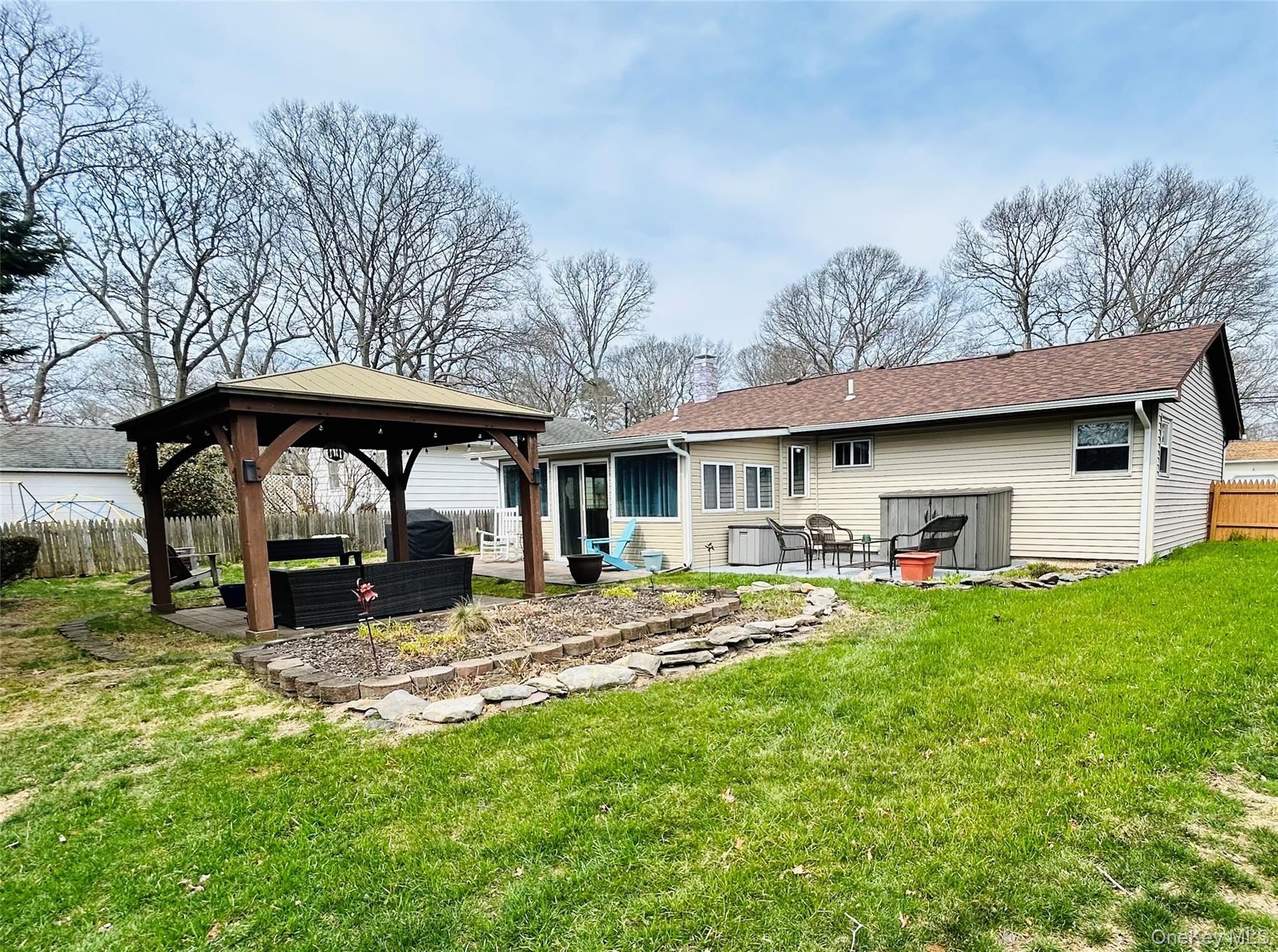 136 B Hampton Avenue Mastic, NY 11950 - Photo 20 of 21 a view of a house with backyard