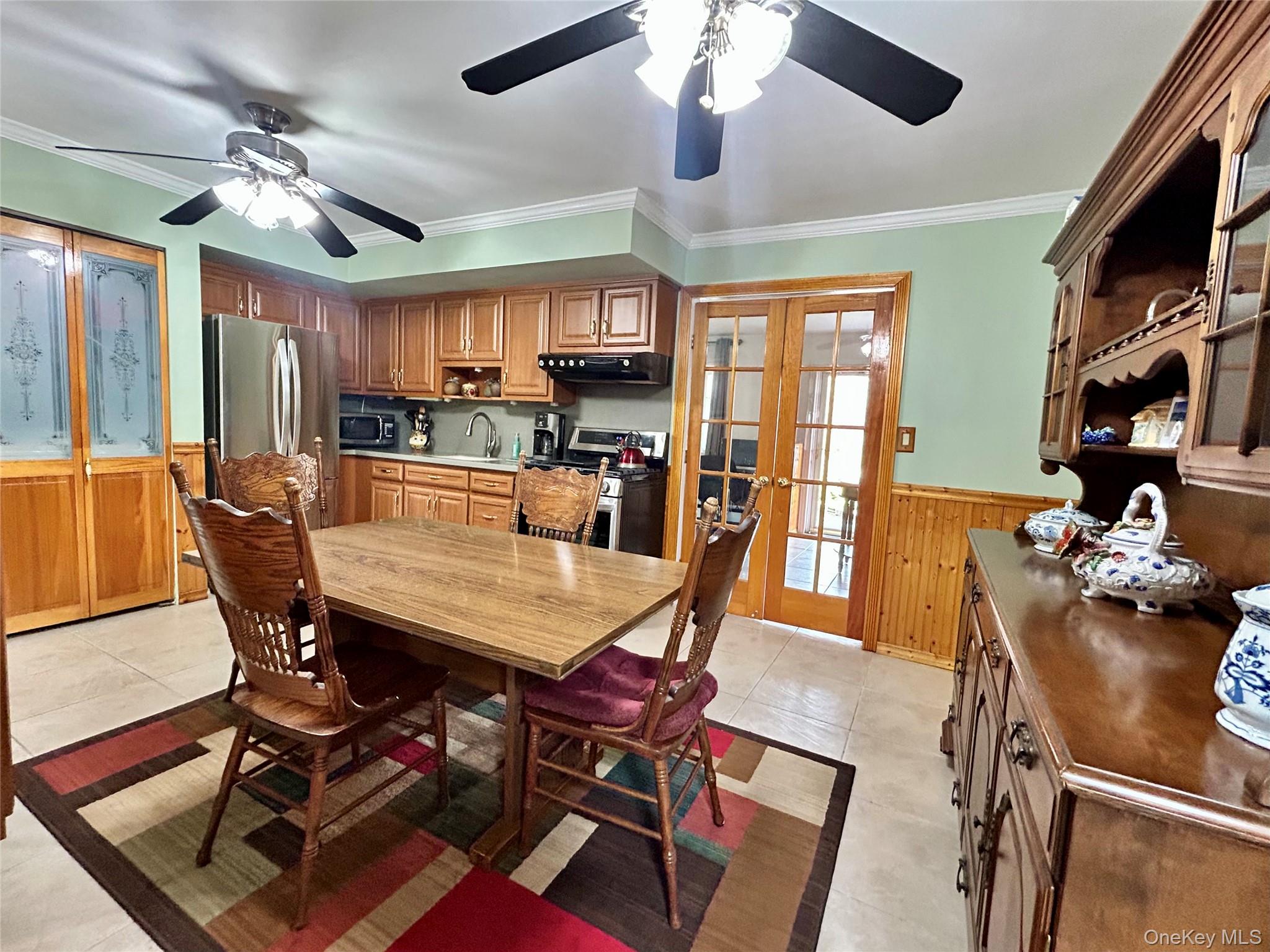 136 B Hampton Avenue Mastic, NY 11950 - Photo 10 of 21 a dining room with furniture a chandelier and wooden floor
