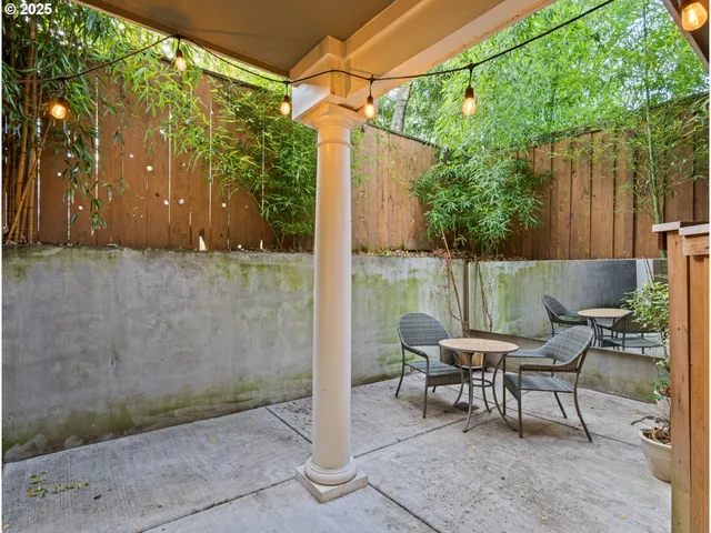 a backyard of a house with outdoor seating and green space