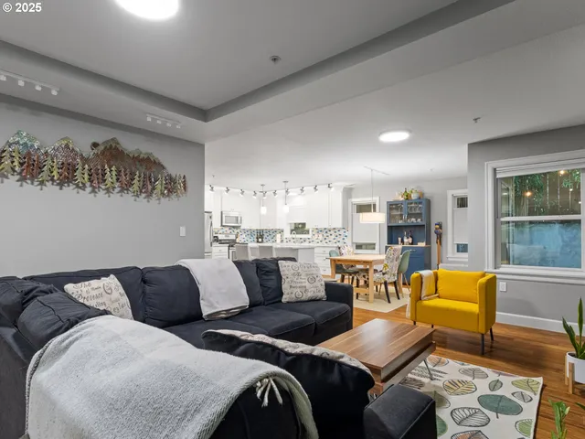 a living room with furniture and a table